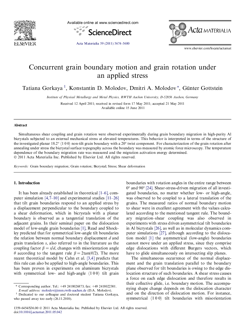 Concurrent grain boundary motion and grain rotation under an applied stress