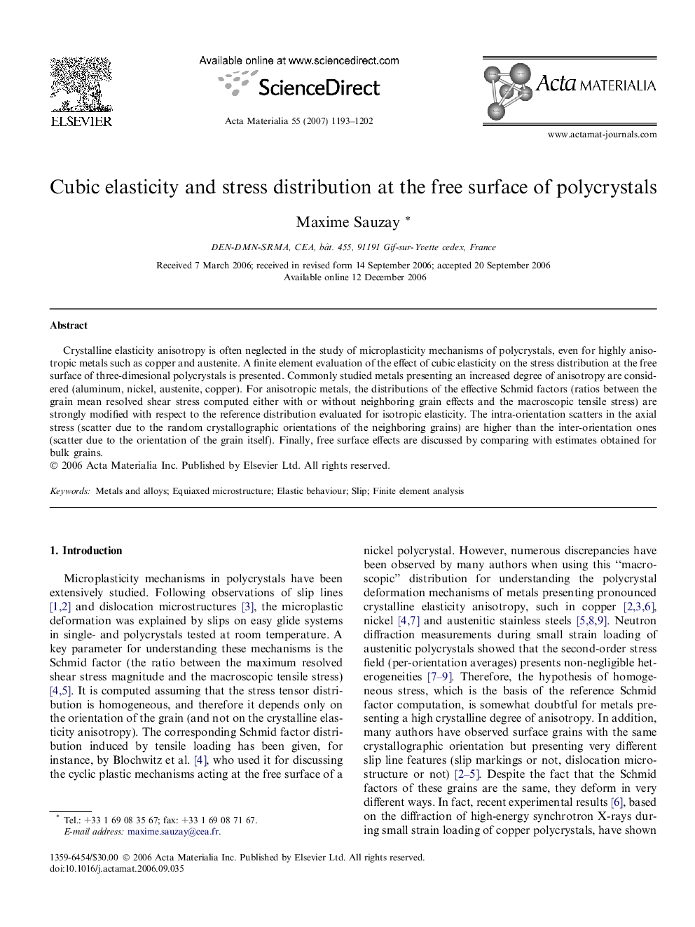 Cubic elasticity and stress distribution at the free surface of polycrystals