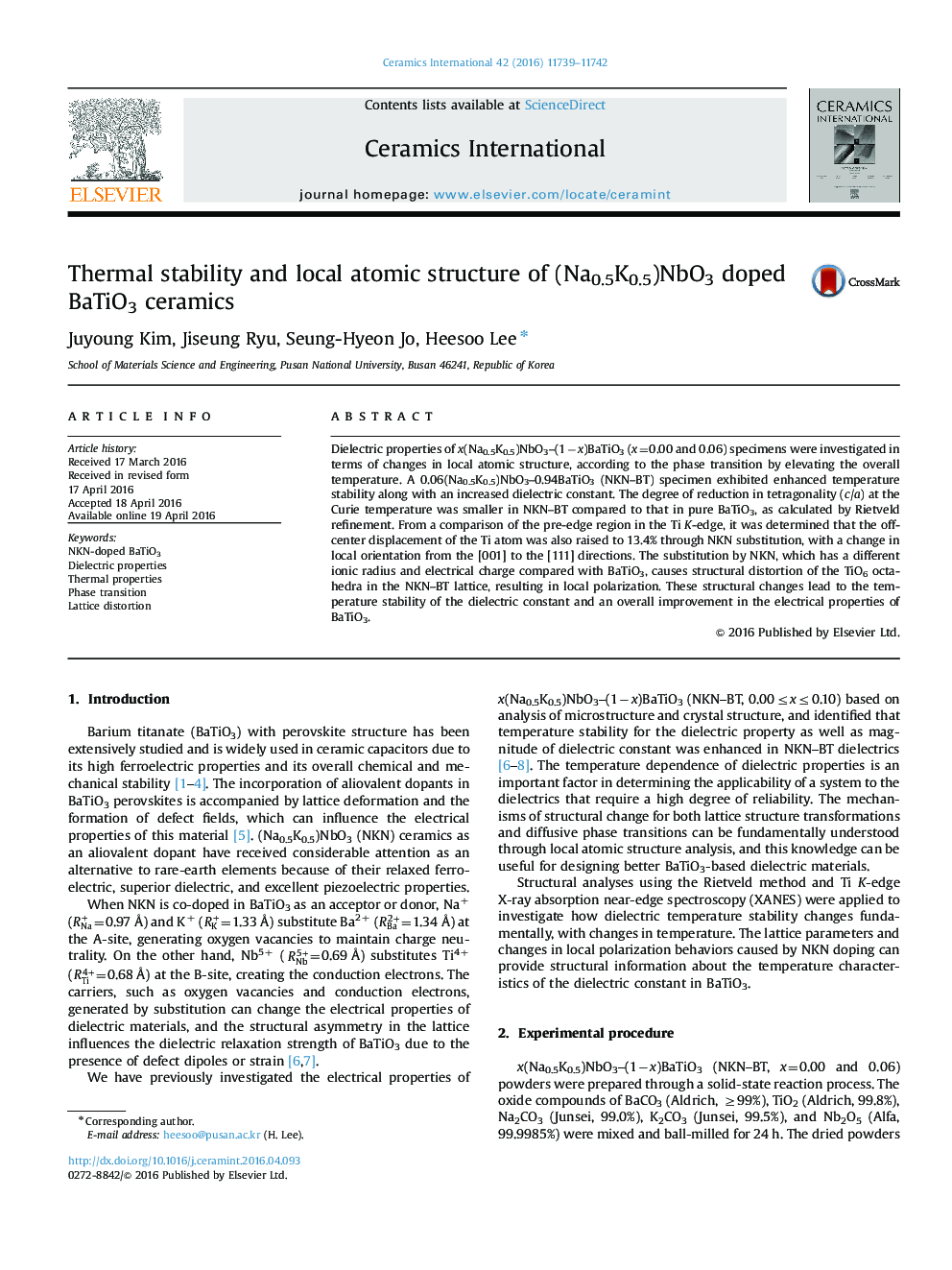 Thermal stability and local atomic structure of (Na0.5K0.5)NbO3 doped BaTiO3 ceramics