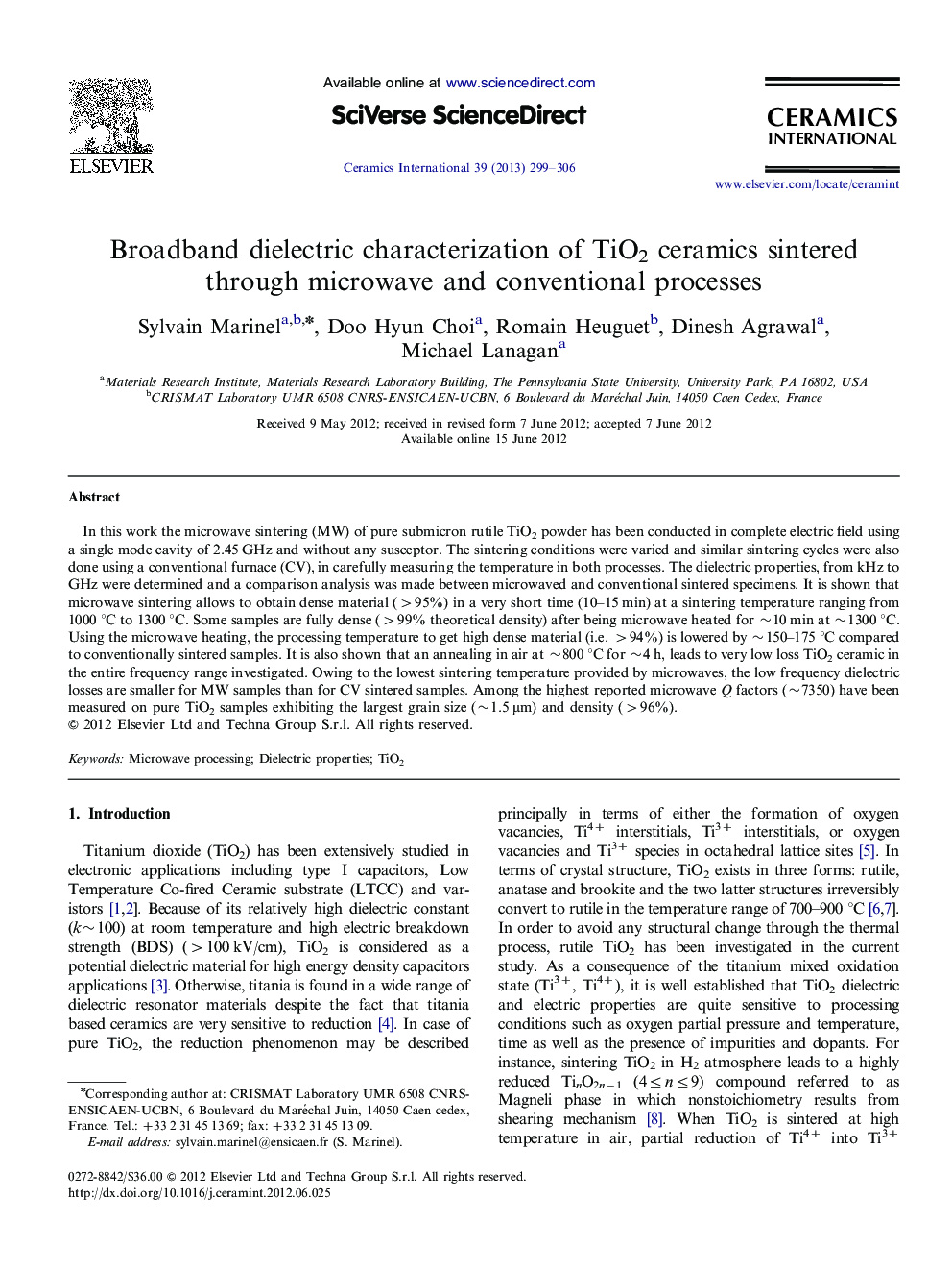 Broadband dielectric characterization of TiO2 ceramics sintered through microwave and conventional processes