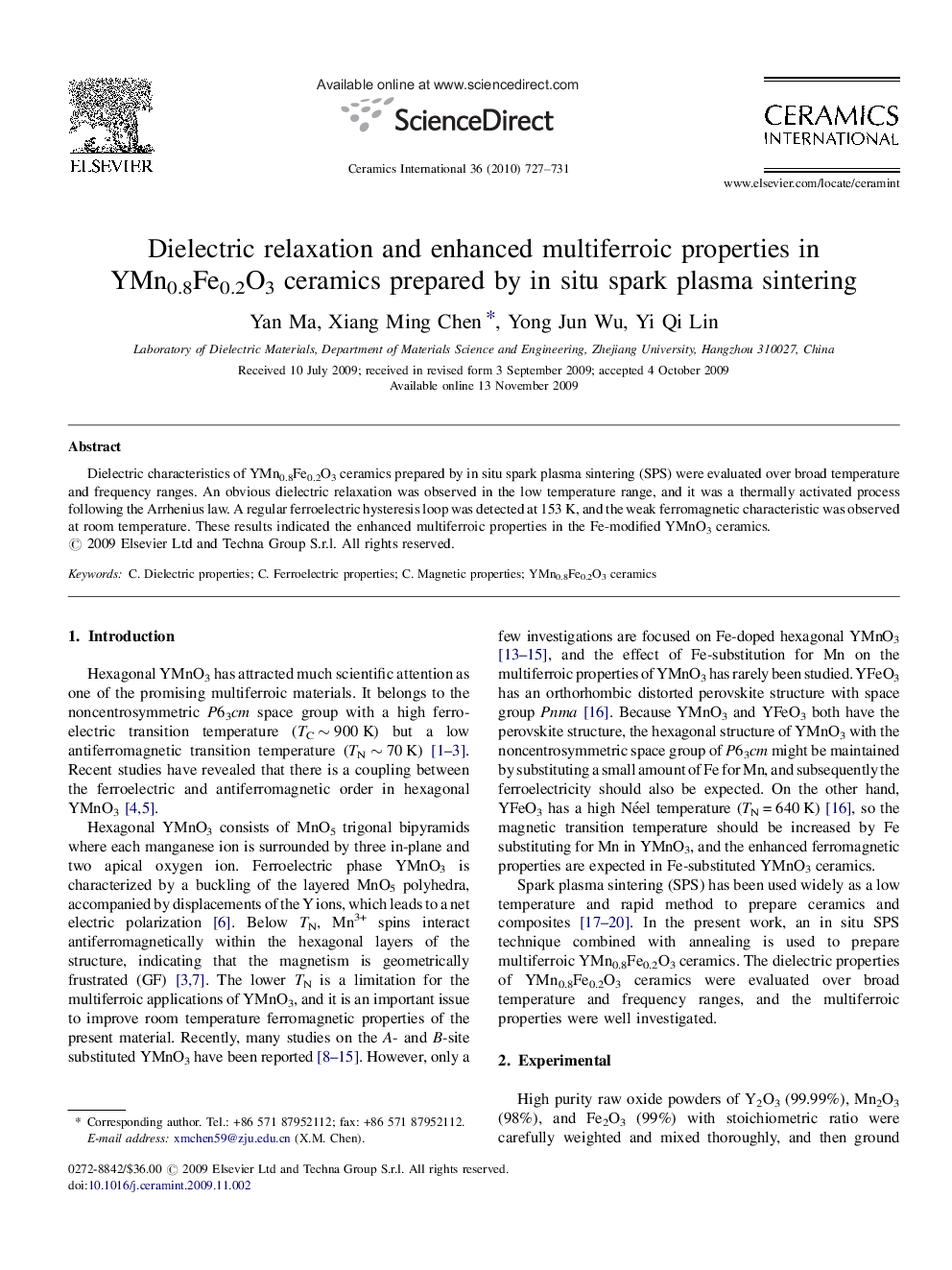 Dielectric relaxation and enhanced multiferroic properties in YMn0.8Fe0.2O3 ceramics prepared by in situ spark plasma sintering