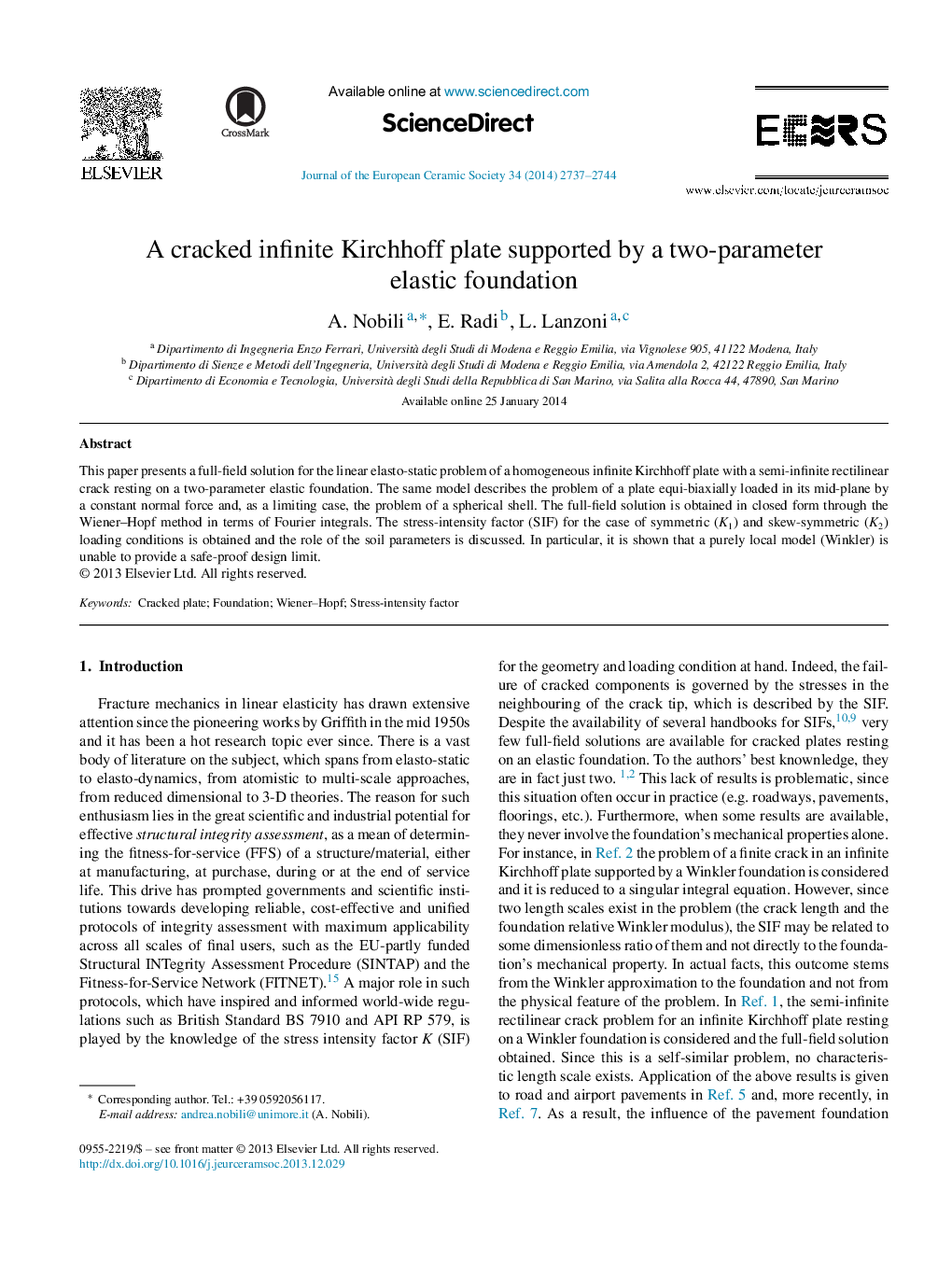 A cracked infinite Kirchhoff plate supported by a two-parameter elastic foundation