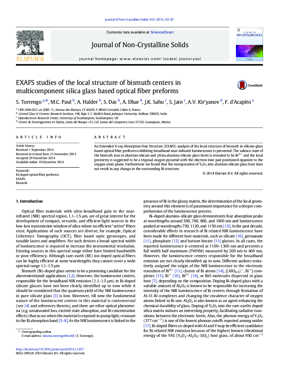 EXAFS studies of the local structure of bismuth centers in multicomponent silica glass based optical fiber preforms