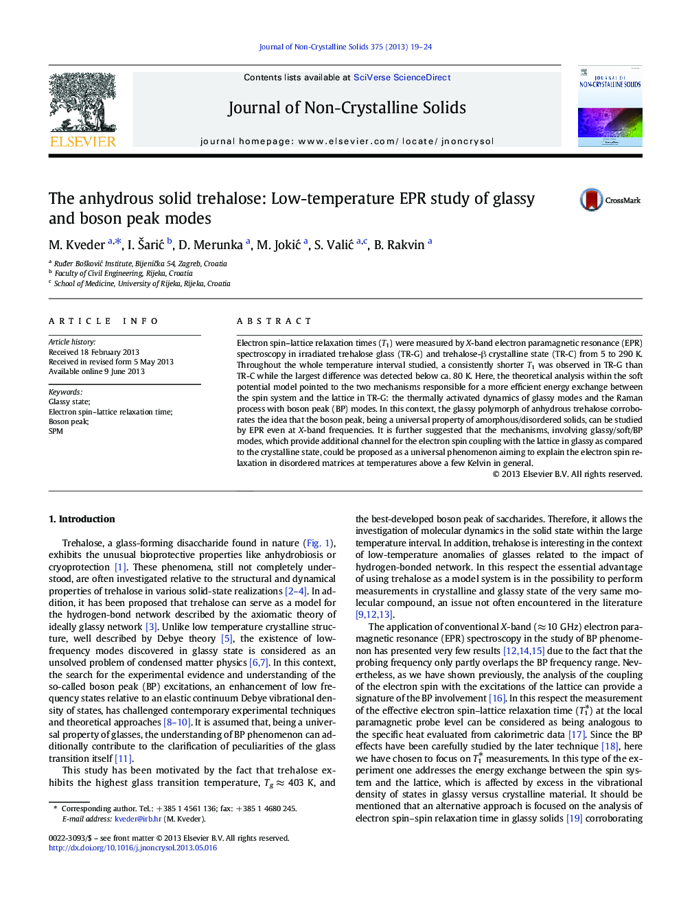 The anhydrous solid trehalose: Low-temperature EPR study of glassy and boson peak modes