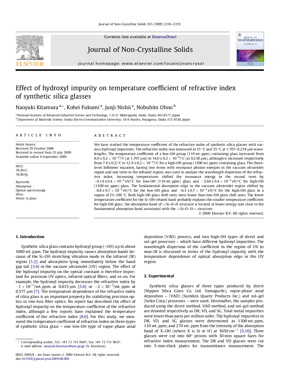 Effect of hydroxyl impurity on temperature coefficient of refractive index of synthetic silica glasses