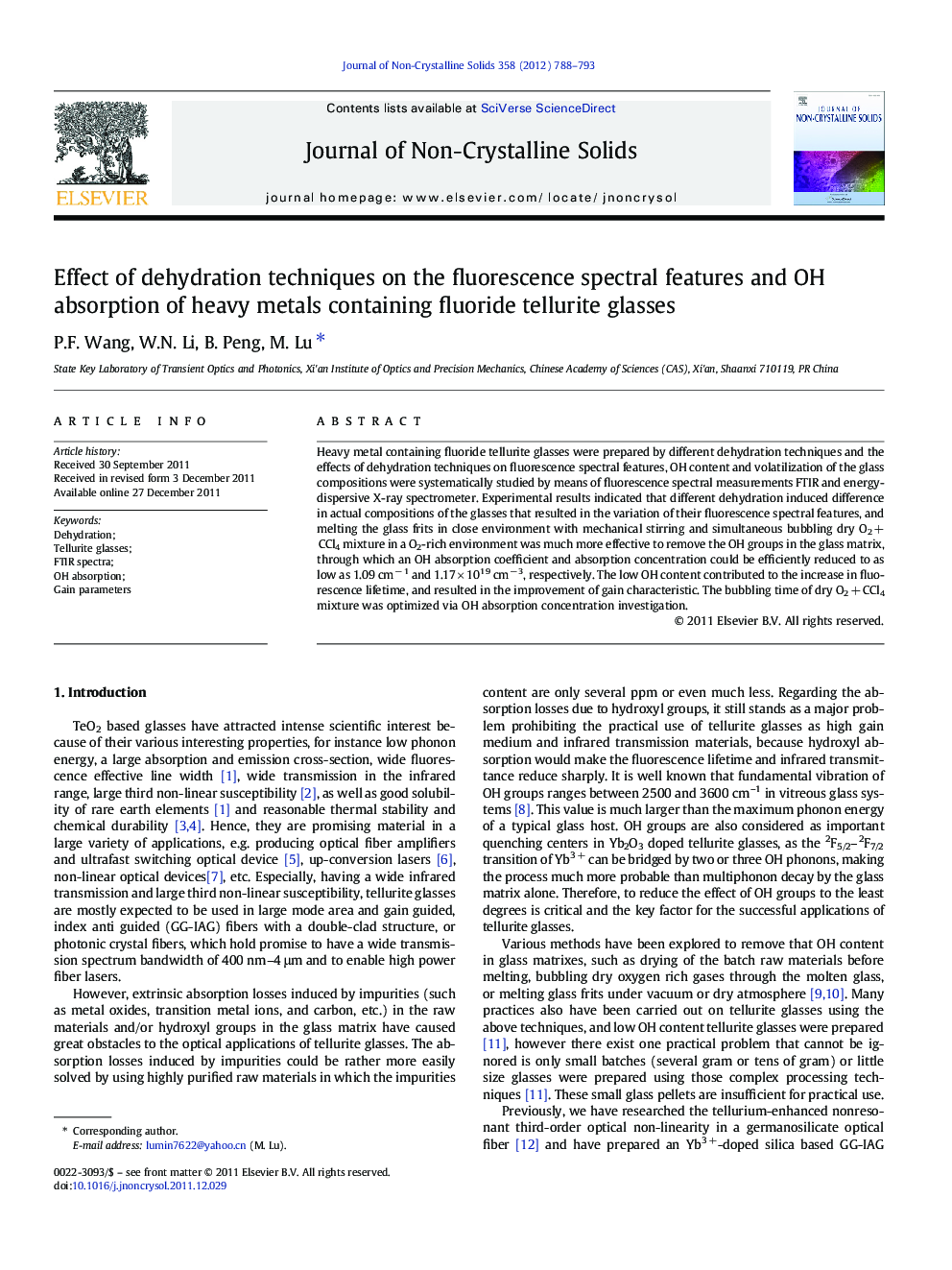 Effect of dehydration techniques on the fluorescence spectral features and OH absorption of heavy metals containing fluoride tellurite glasses