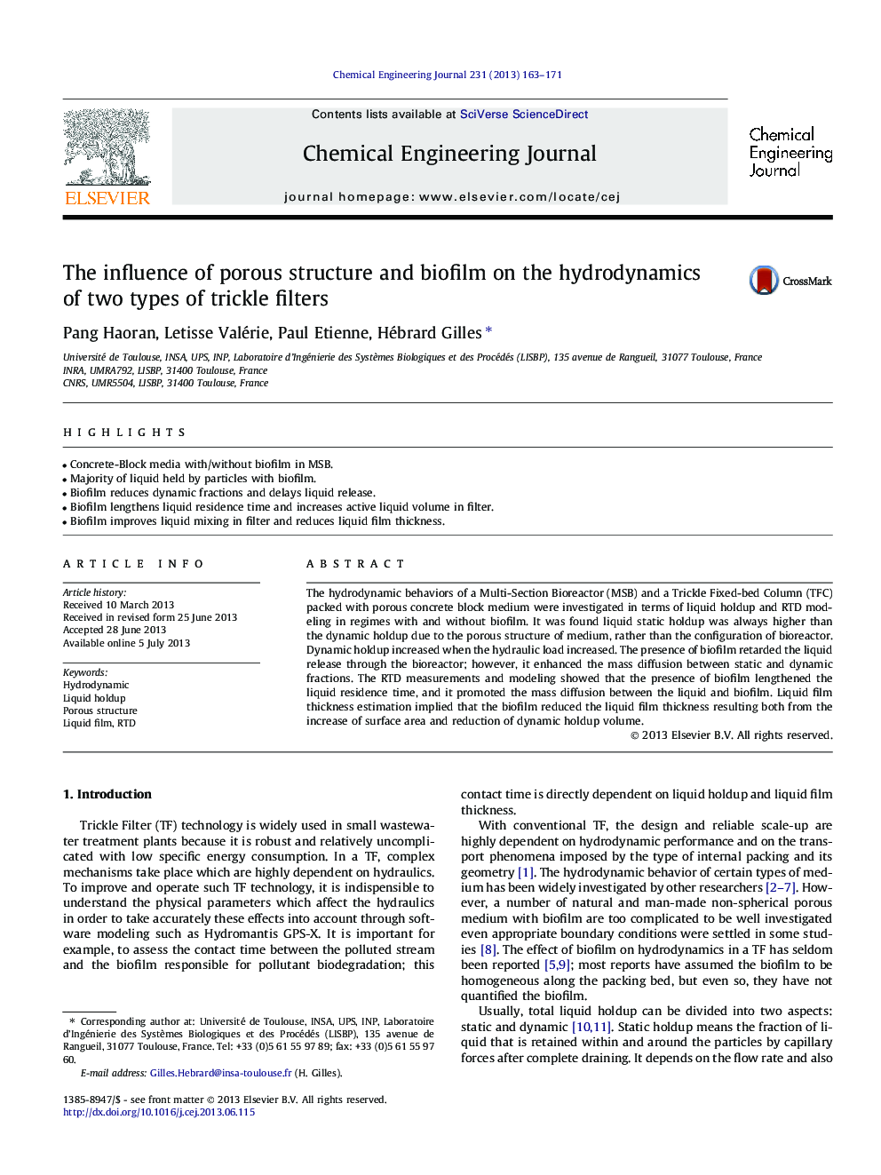 The influence of porous structure and biofilm on the hydrodynamics of two types of trickle filters