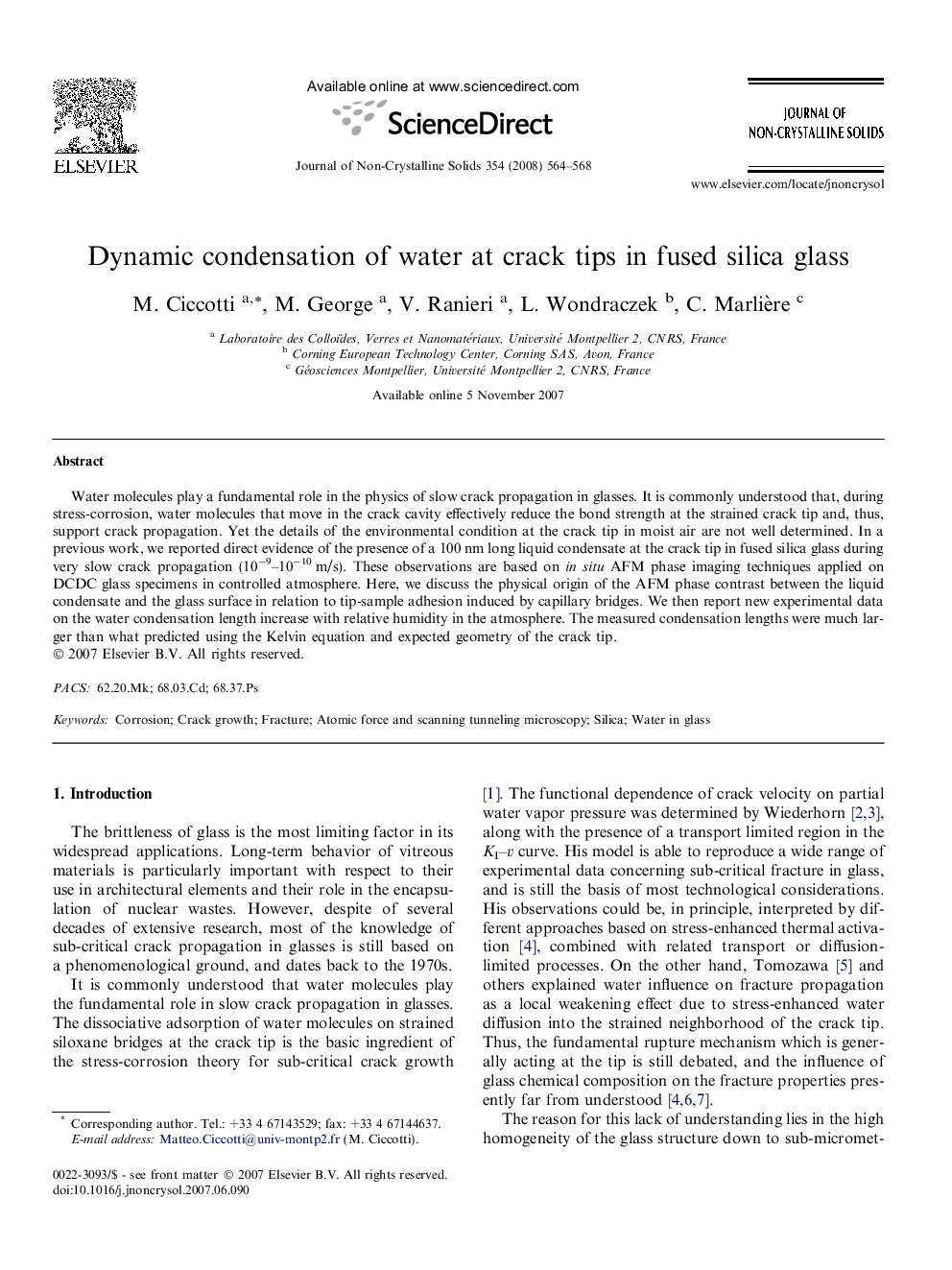 Dynamic condensation of water at crack tips in fused silica glass