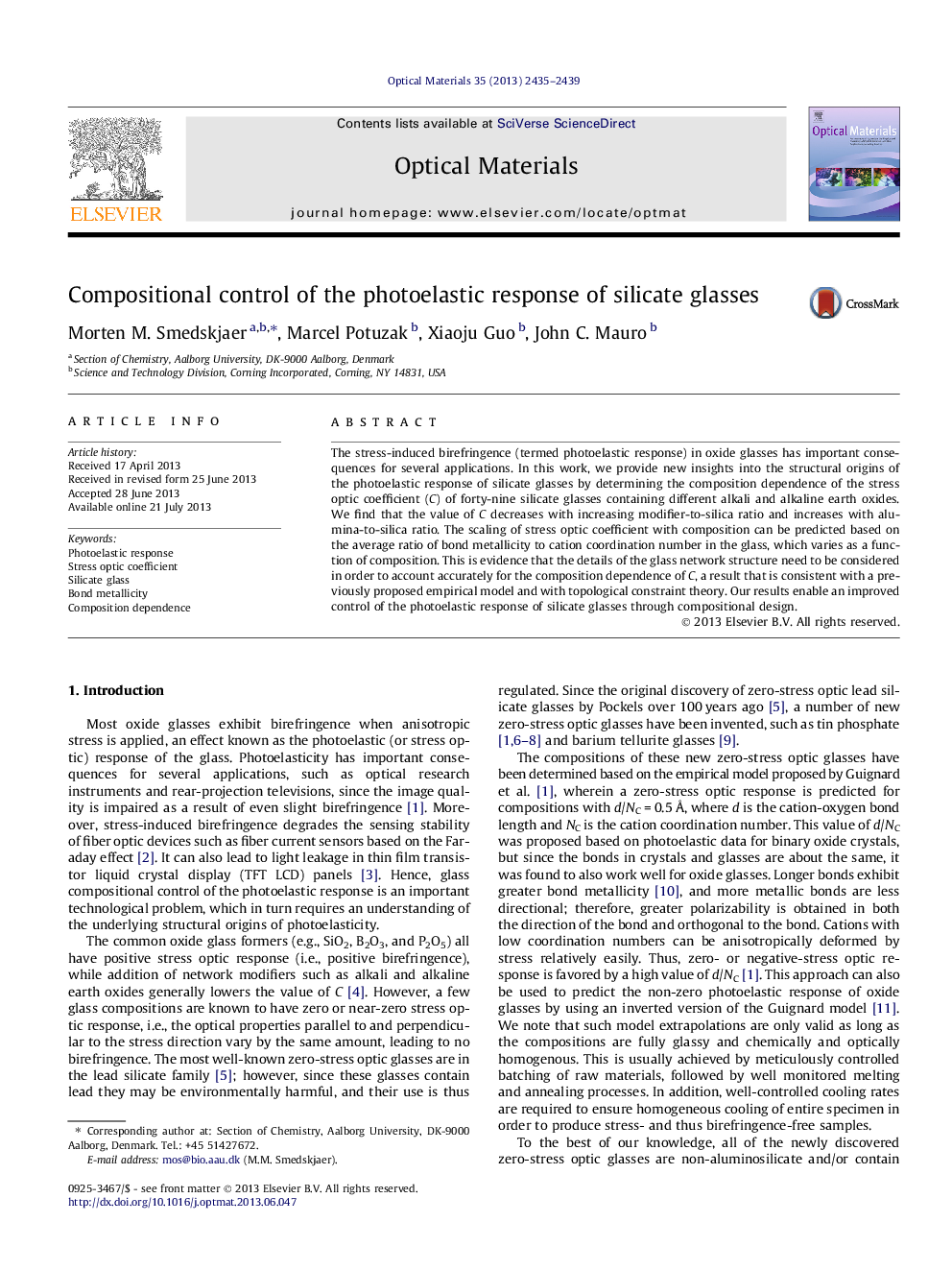 Compositional control of the photoelastic response of silicate glasses