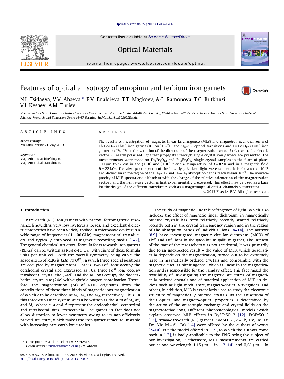 Features of optical anisotropy of europium and terbium iron garnets