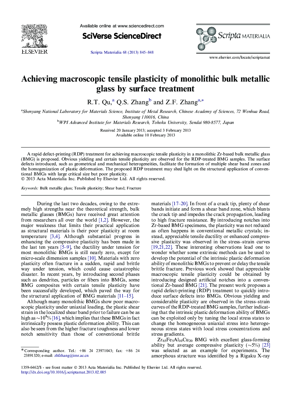 Achieving macroscopic tensile plasticity of monolithic bulk metallic glass by surface treatment