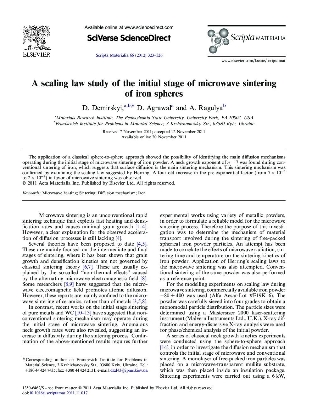A scaling law study of the initial stage of microwave sintering of iron spheres