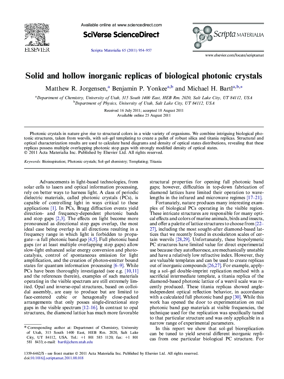 Solid and hollow inorganic replicas of biological photonic crystals