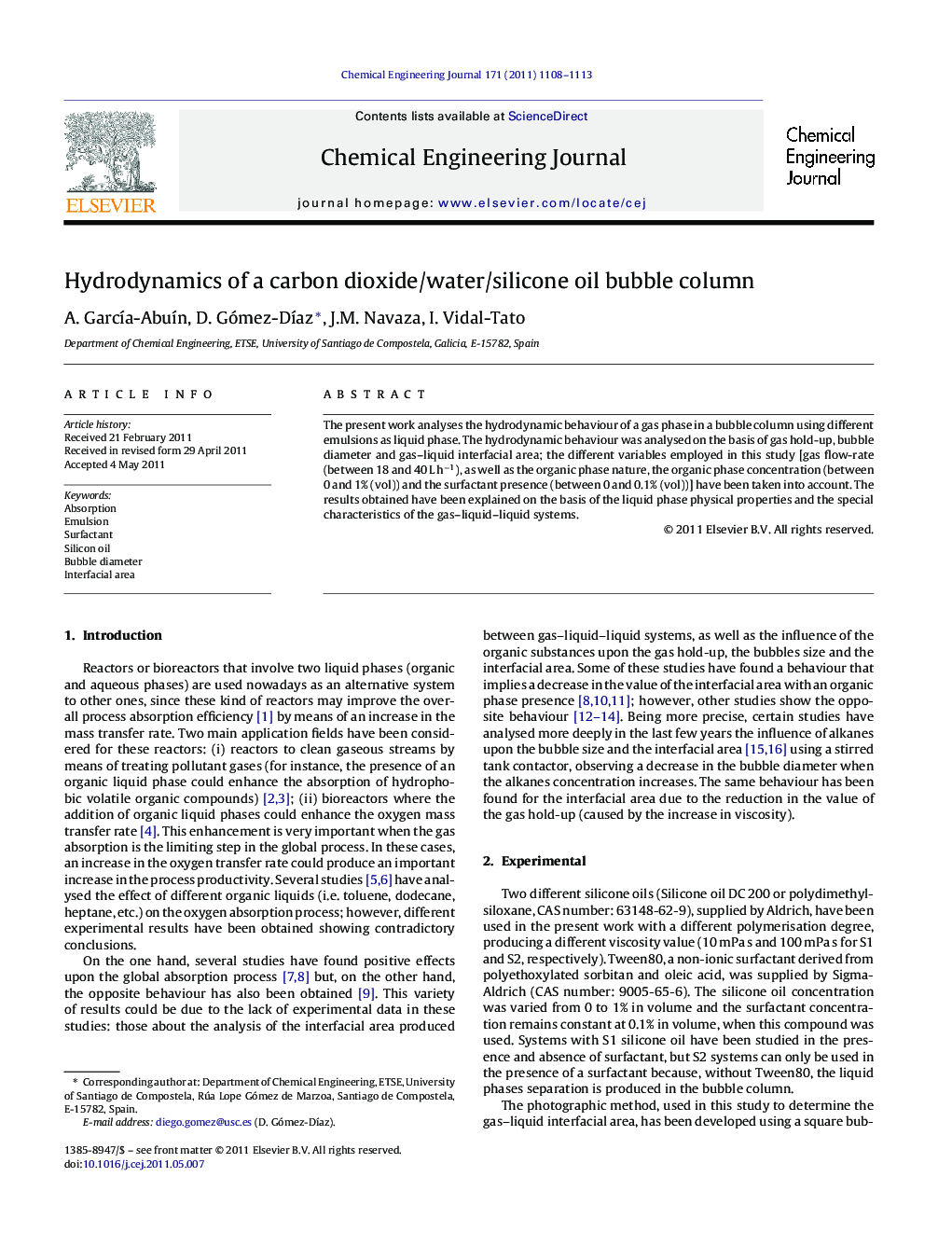 Hydrodynamics of a carbon dioxide/water/silicone oil bubble column