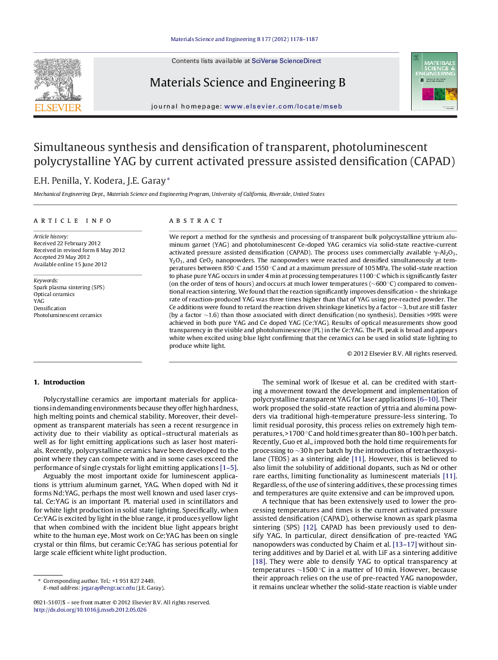 Simultaneous synthesis and densification of transparent, photoluminescent polycrystalline YAG by current activated pressure assisted densification (CAPAD)