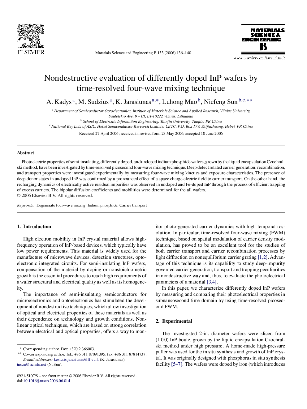 Nondestructive evaluation of differently doped InP wafers by time-resolved four-wave mixing technique