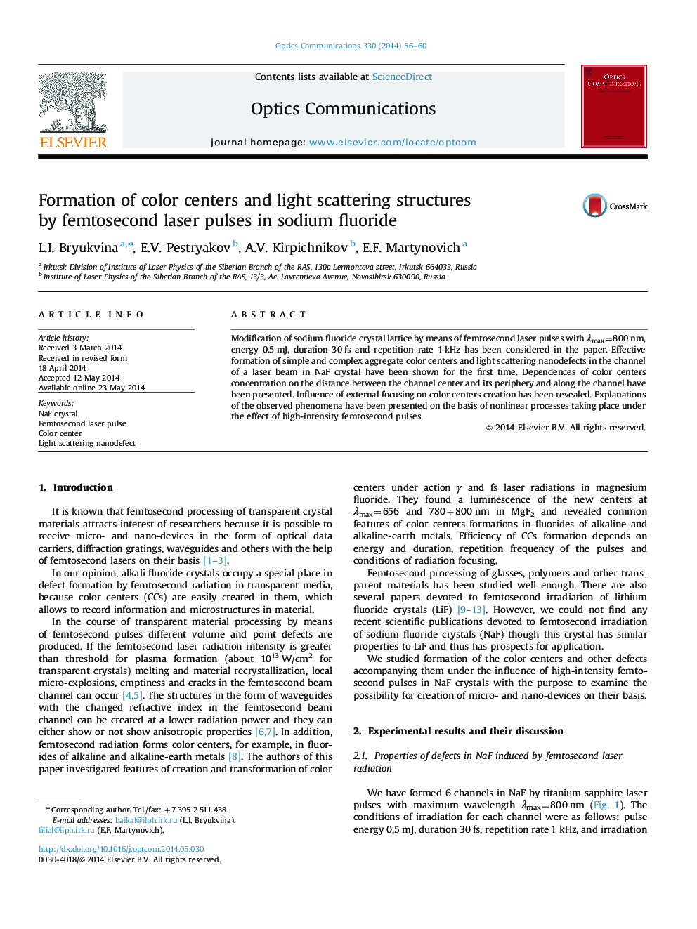 Formation of color centers and light scattering structures by femtosecond laser pulses in sodium fluoride