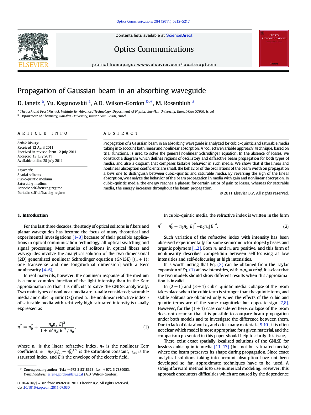 Propagation of Gaussian beam in an absorbing waveguide