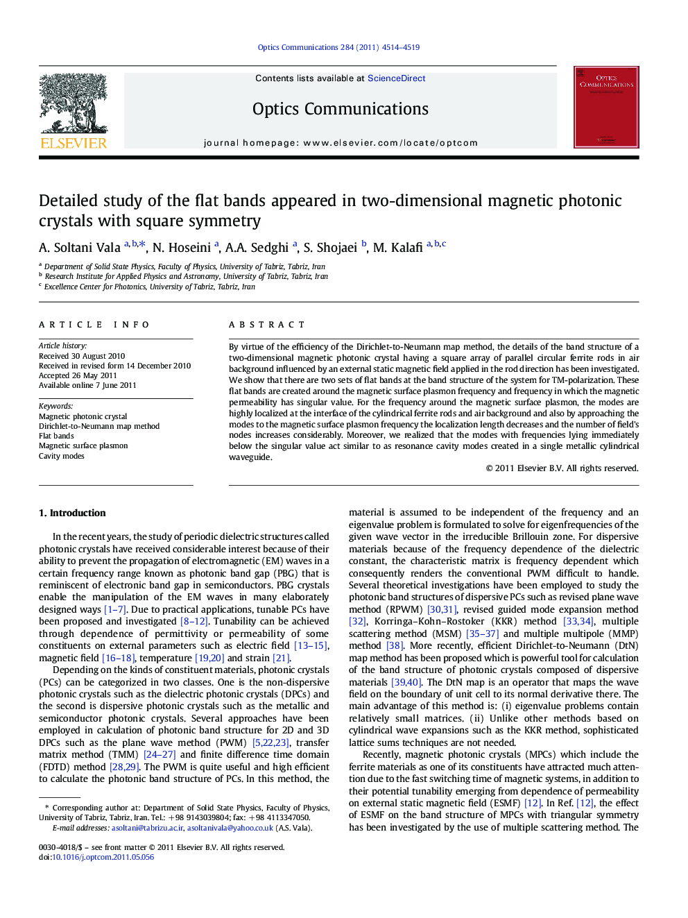 Detailed study of the flat bands appeared in two-dimensional magnetic photonic crystals with square symmetry