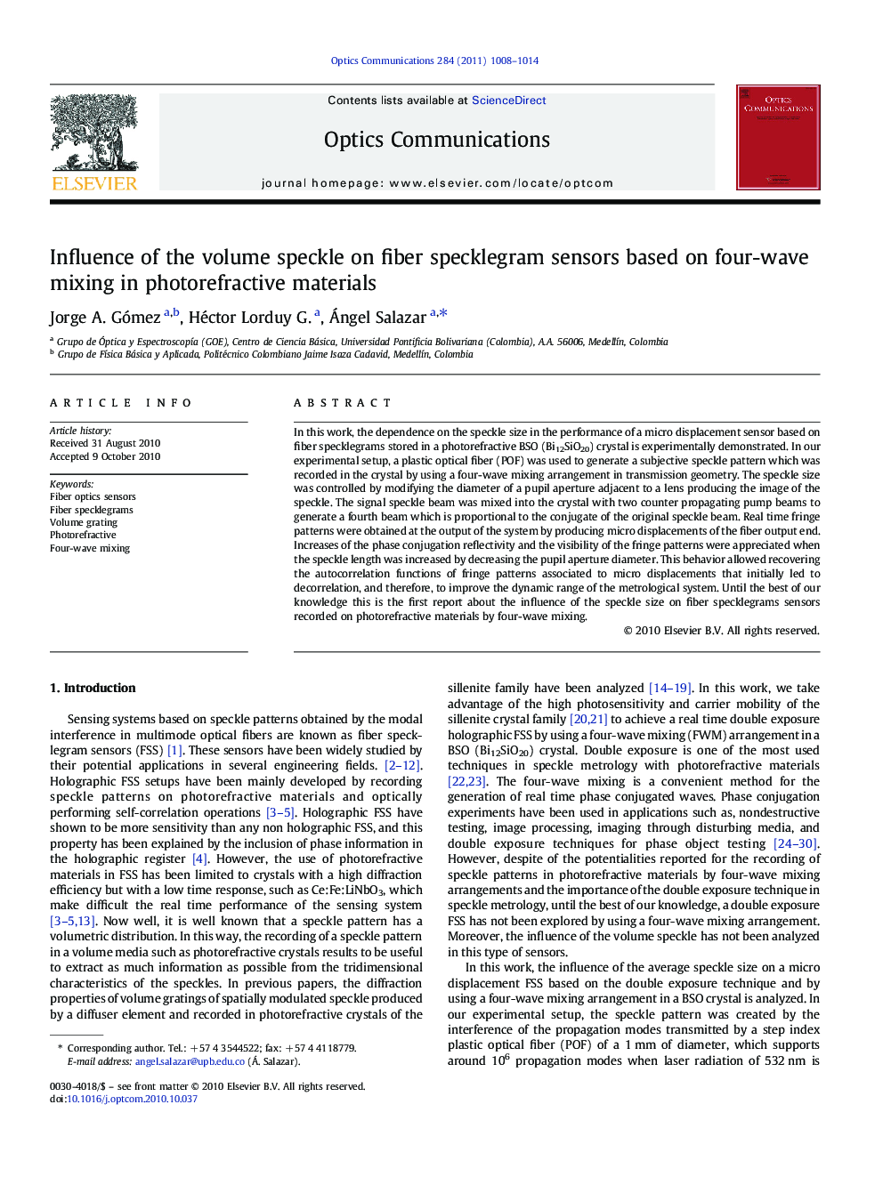 Influence of the volume speckle on fiber specklegram sensors based on four-wave mixing in photorefractive materials