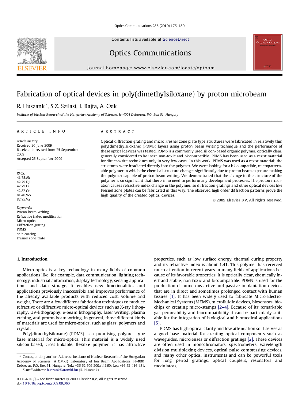 Fabrication of optical devices in poly(dimethylsiloxane) by proton microbeam