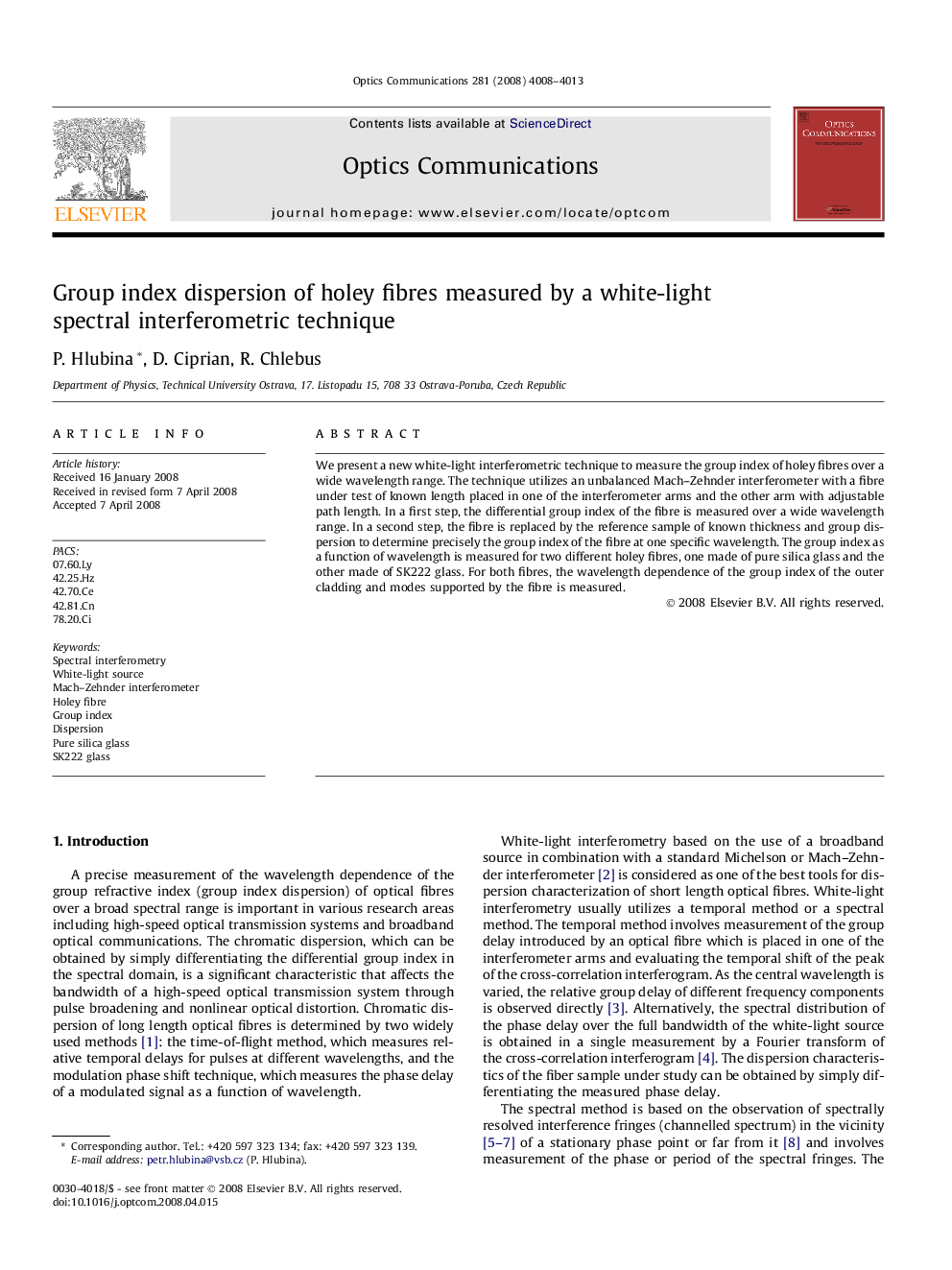 Group index dispersion of holey fibres measured by a white-light spectral interferometric technique