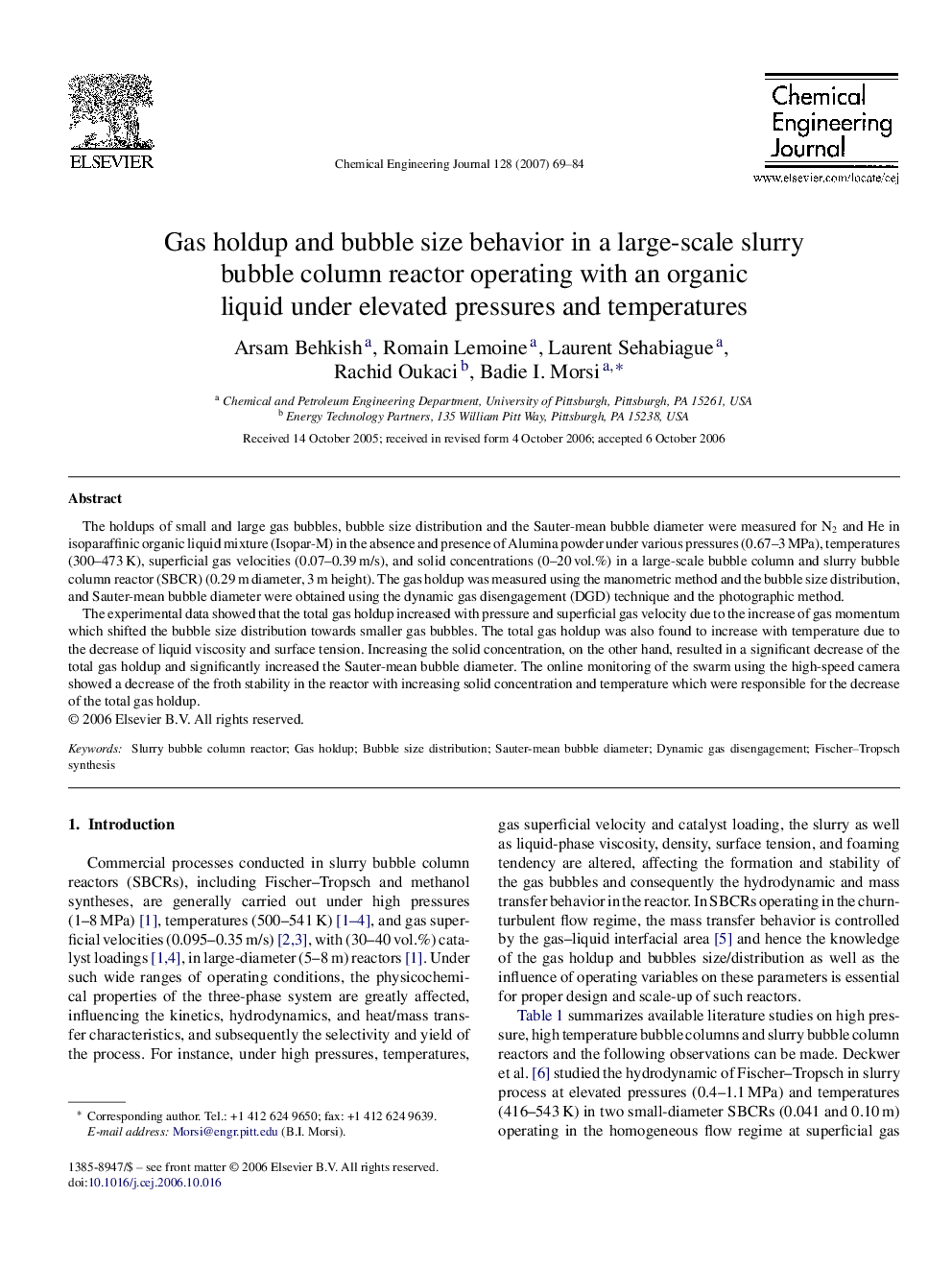 Gas holdup and bubble size behavior in a large-scale slurry bubble column reactor operating with an organic liquid under elevated pressures and temperatures