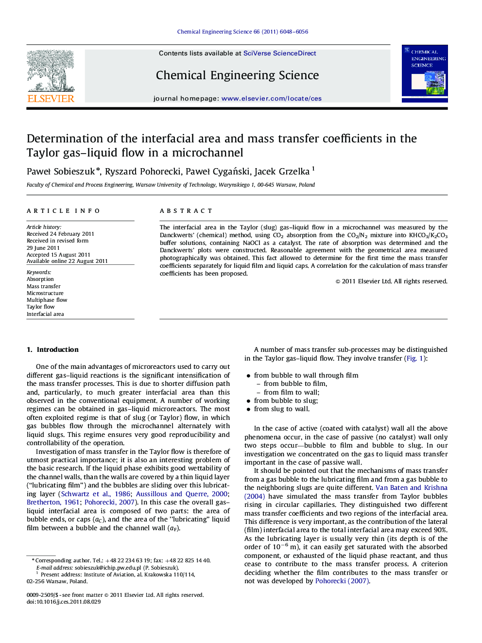 Determination of the interfacial area and mass transfer coefficients in the Taylor gas–liquid flow in a microchannel