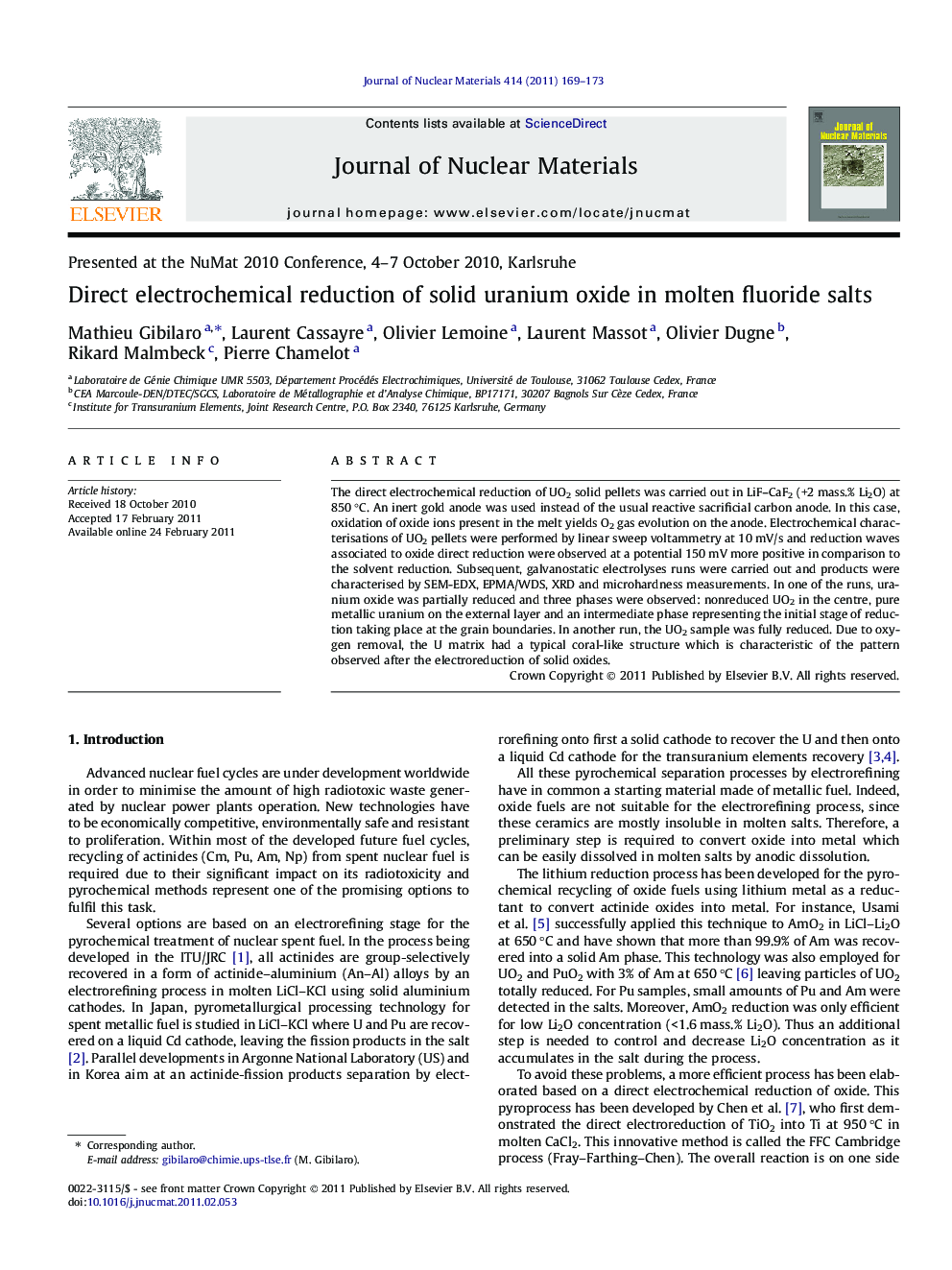 Direct electrochemical reduction of solid uranium oxide in molten fluoride salts