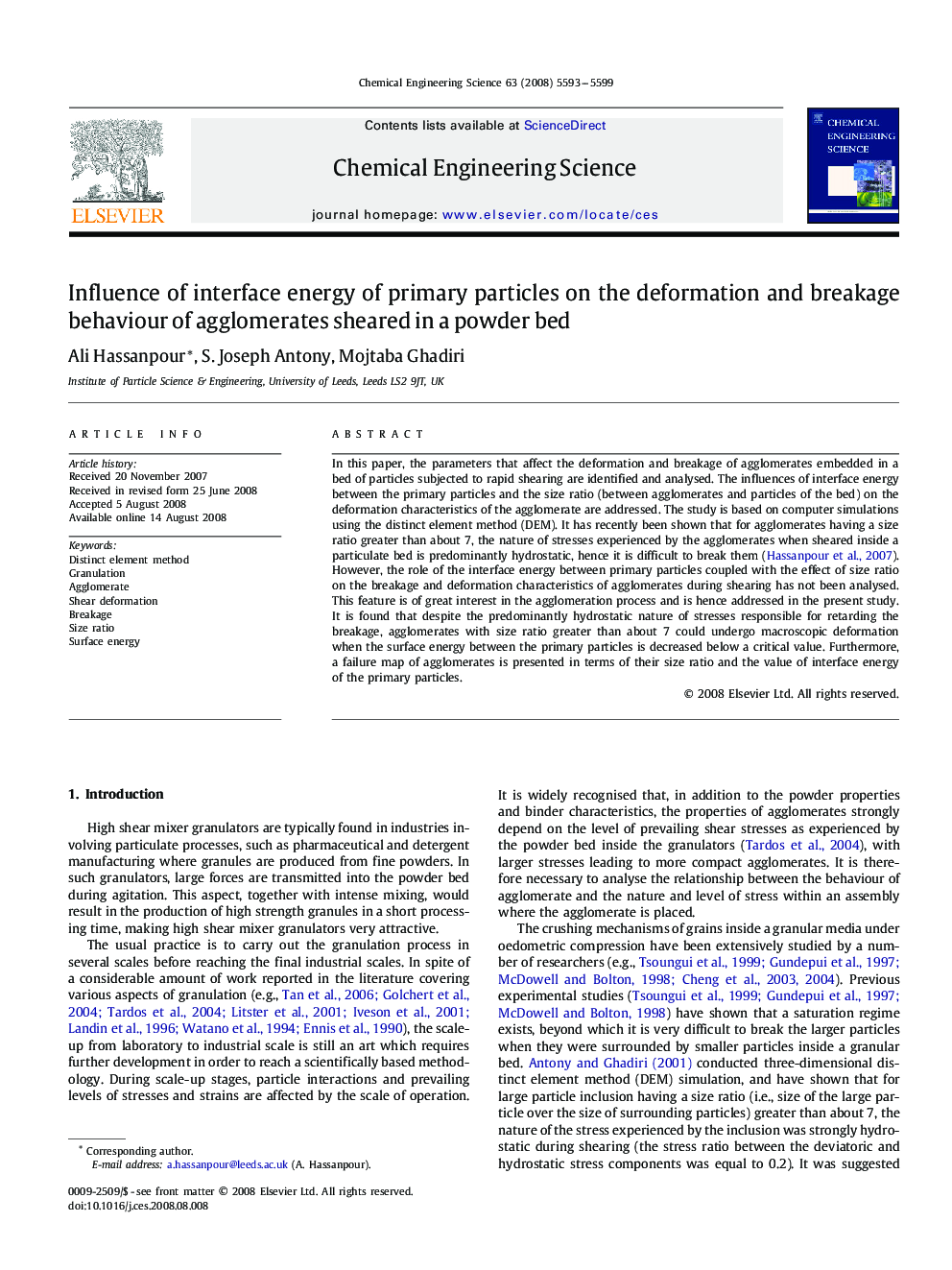 Influence of interface energy of primary particles on the deformation and breakage behaviour of agglomerates sheared in a powder bed