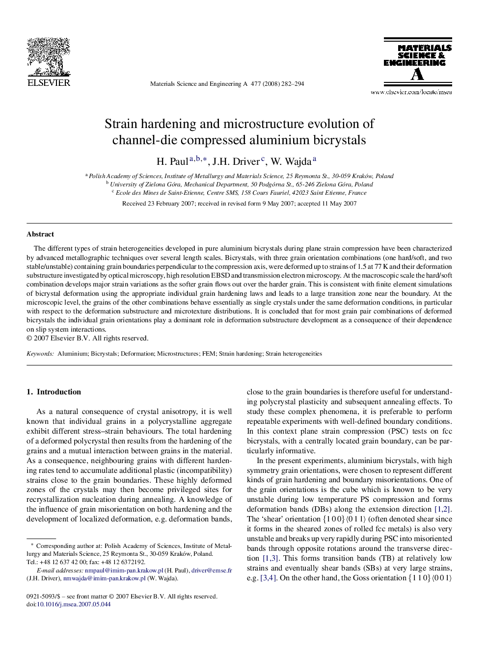 Strain hardening and microstructure evolution of channel-die compressed aluminium bicrystals