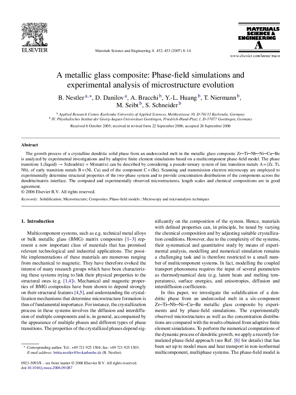 A metallic glass composite: Phase-field simulations and experimental analysis of microstructure evolution