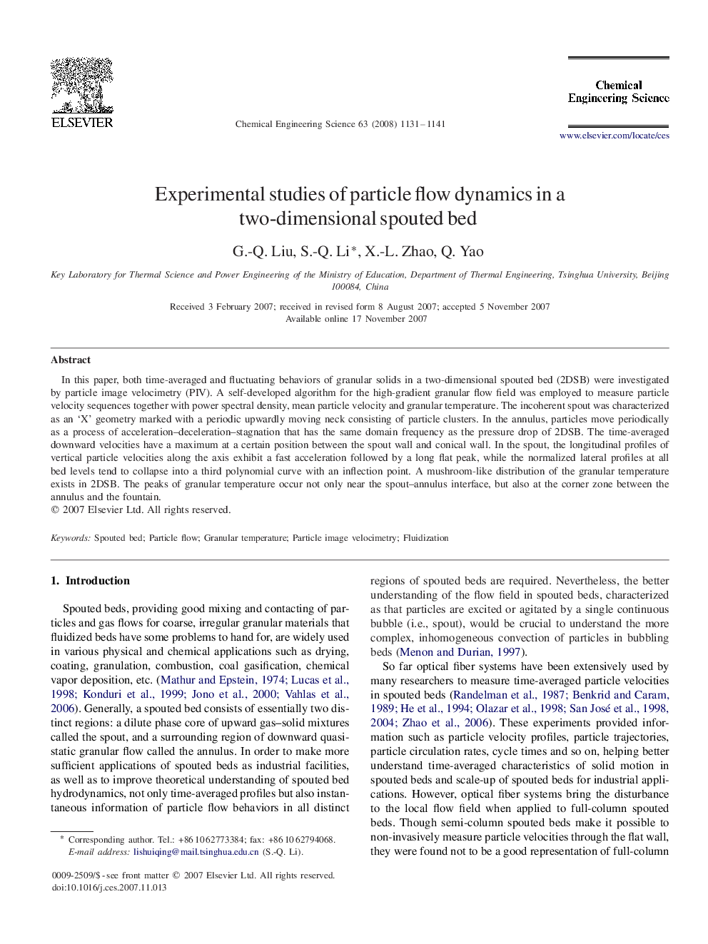 Experimental studies of particle flow dynamics in a two-dimensional spouted bed