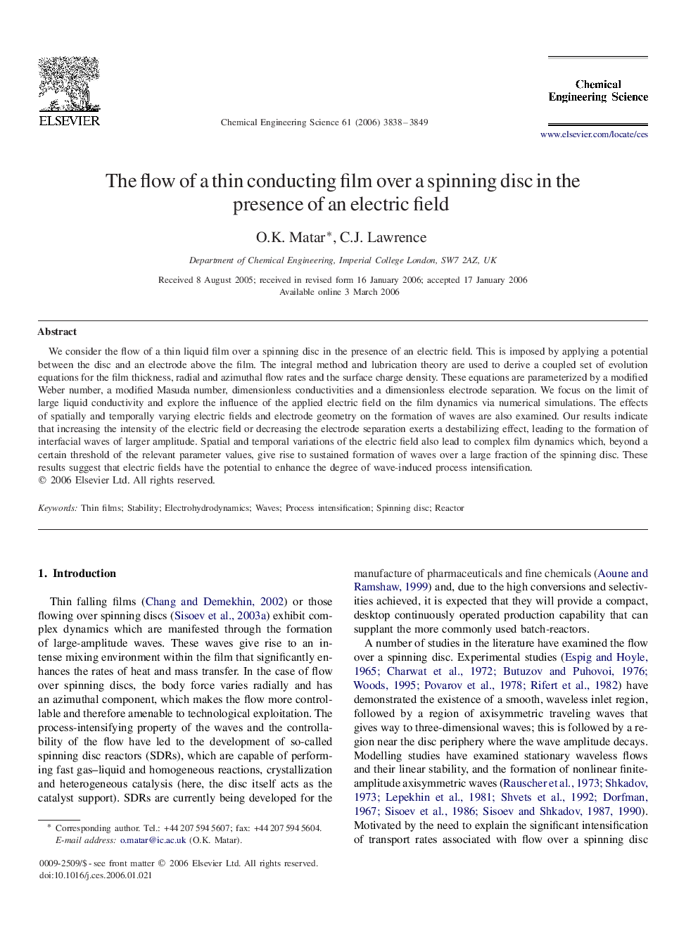 The flow of a thin conducting film over a spinning disc in the presence of an electric field