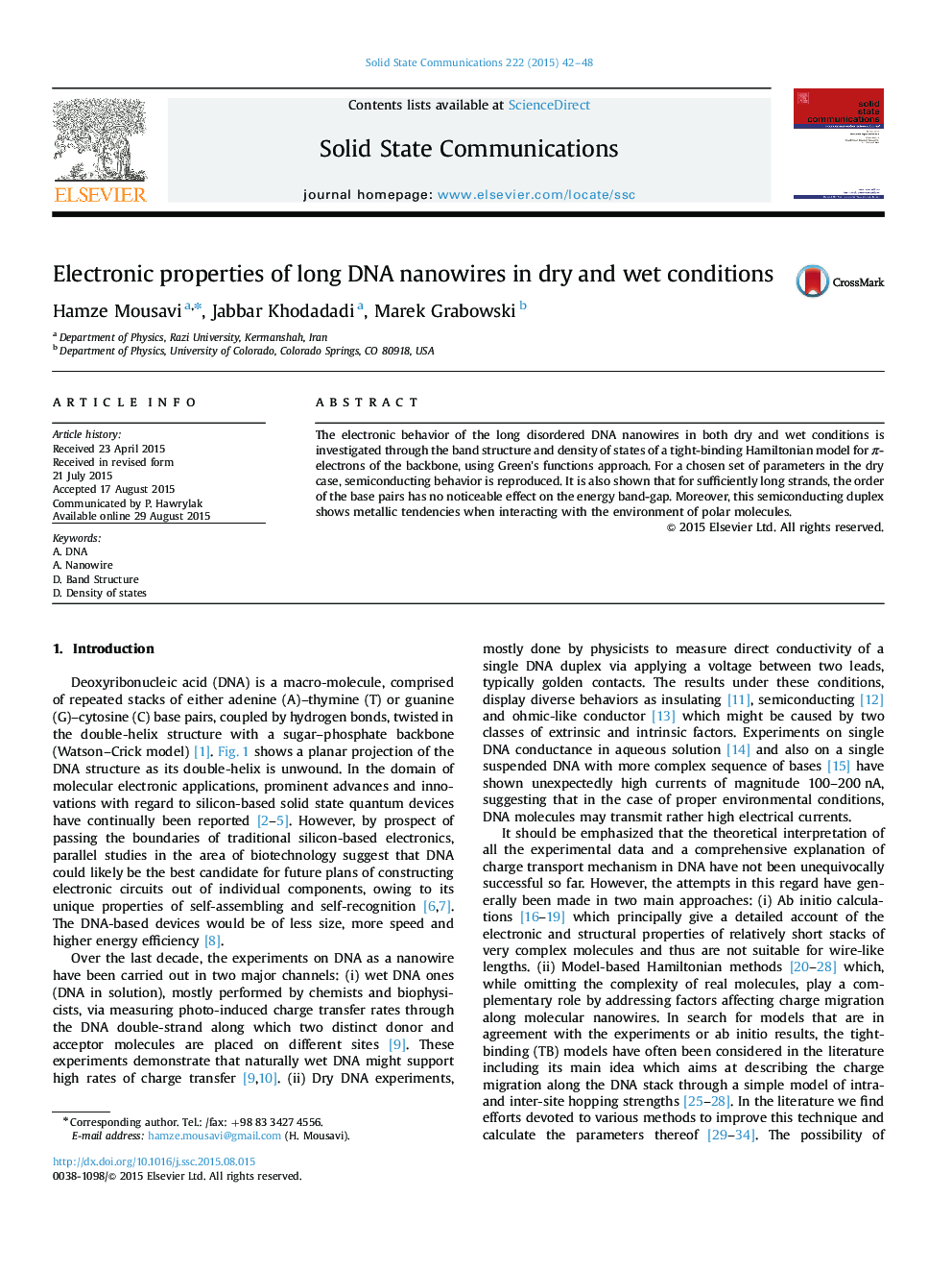 Electronic properties of long DNA nanowires in dry and wet conditions