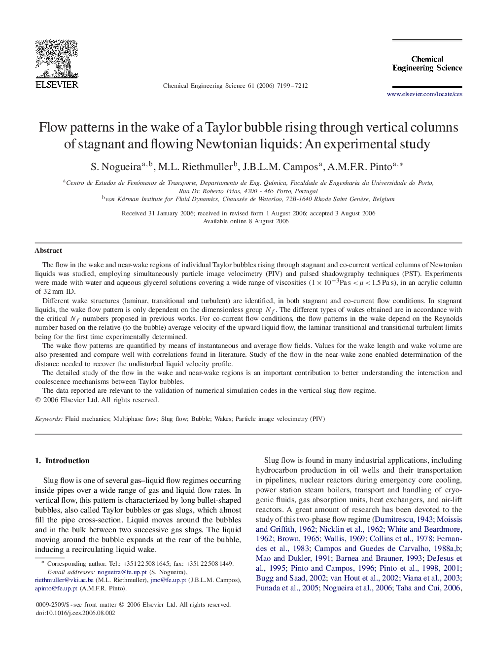 Flow patterns in the wake of a Taylor bubble rising through vertical columns of stagnant and flowing Newtonian liquids: An experimental study