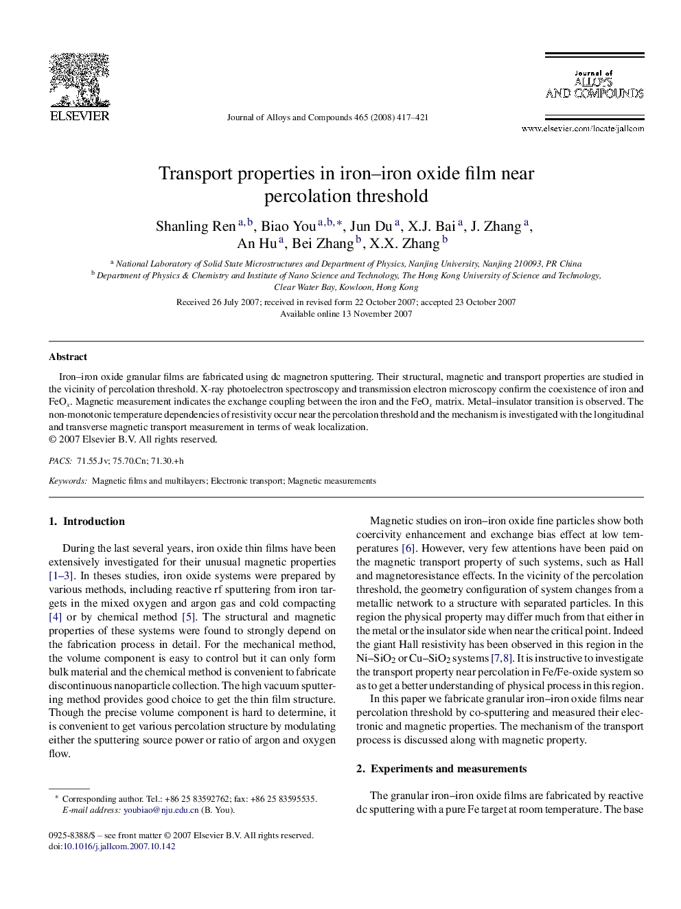 Transport properties in iron-iron oxide film near percolation threshold