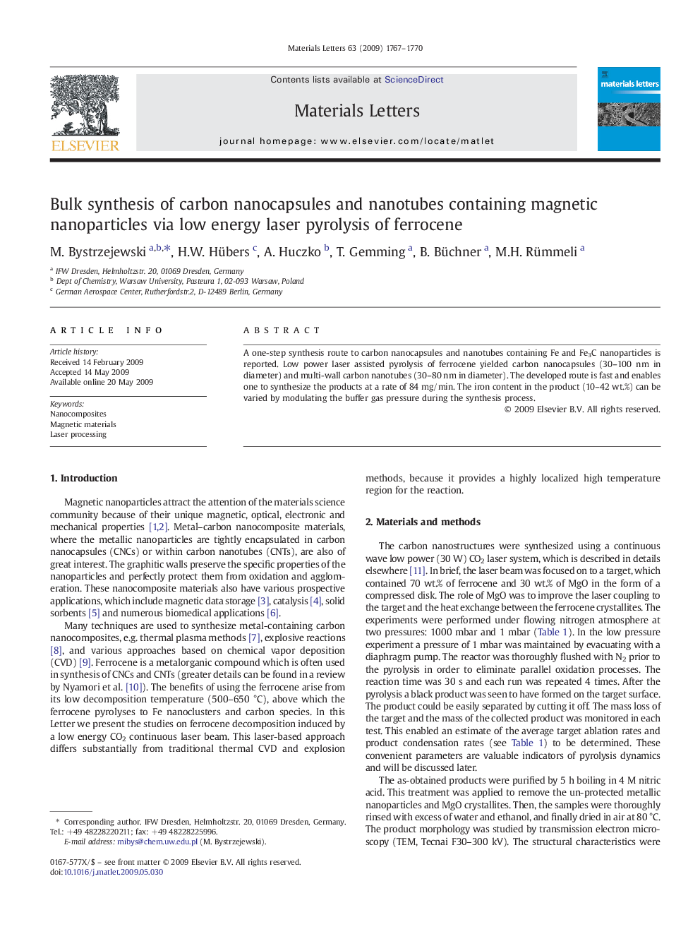 Bulk synthesis of carbon nanocapsules and nanotubes containing magnetic nanoparticles via low energy laser pyrolysis of ferrocene