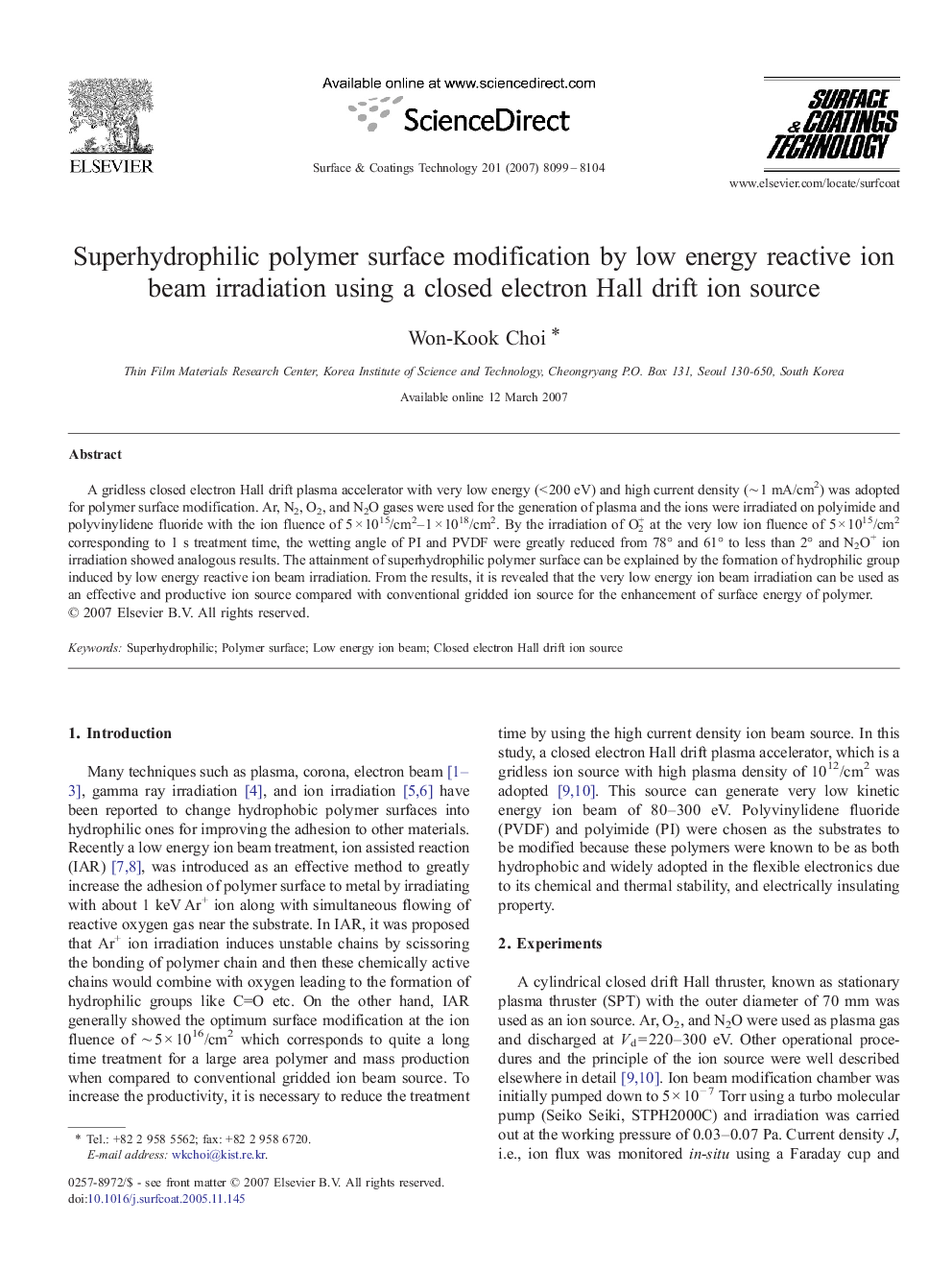 Superhydrophilic polymer surface modification by low energy reactive ion beam irradiation using a closed electron Hall drift ion source