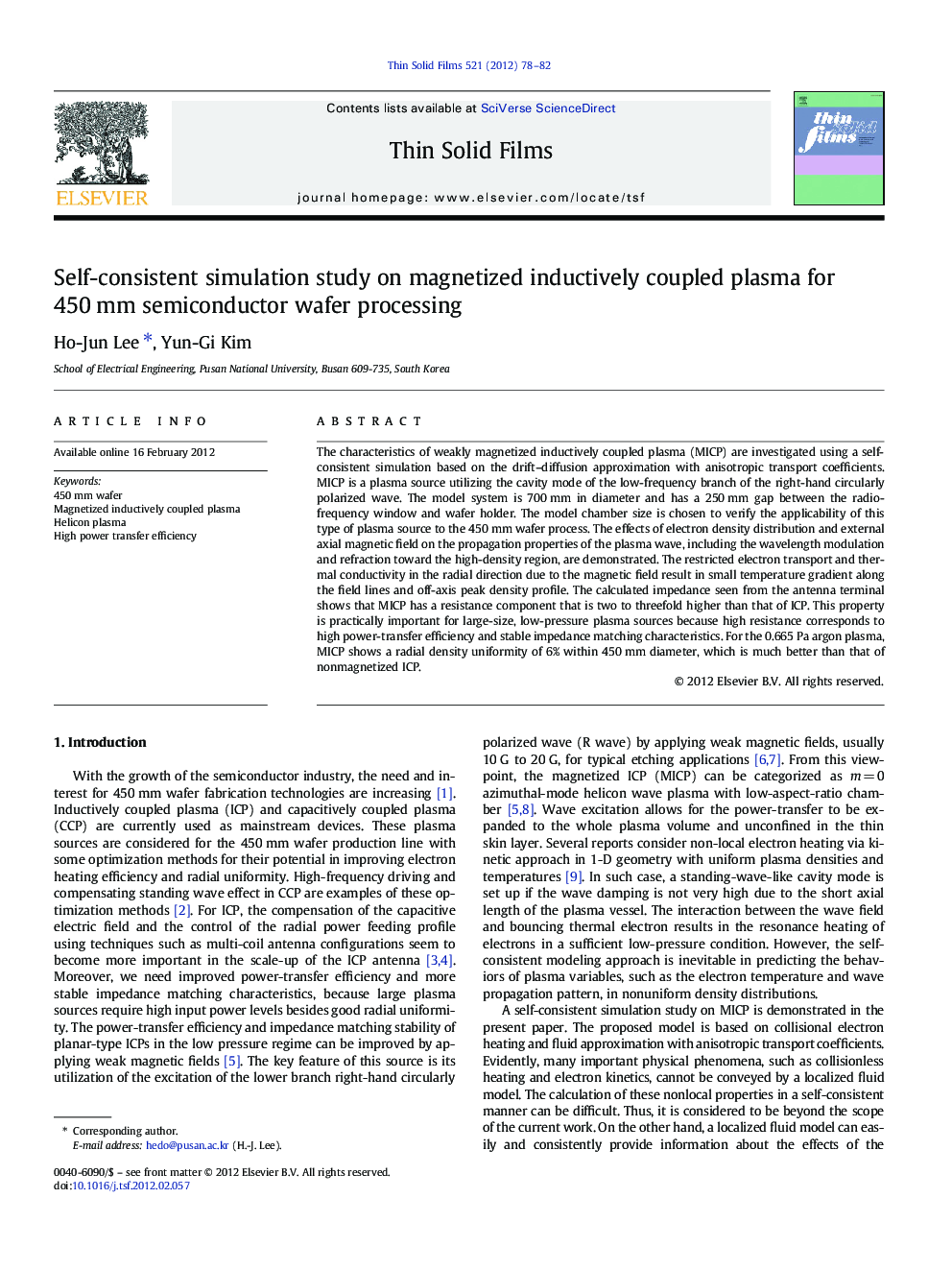 Self-consistent simulation study on magnetized inductively coupled plasma for 450 mm semiconductor wafer processing