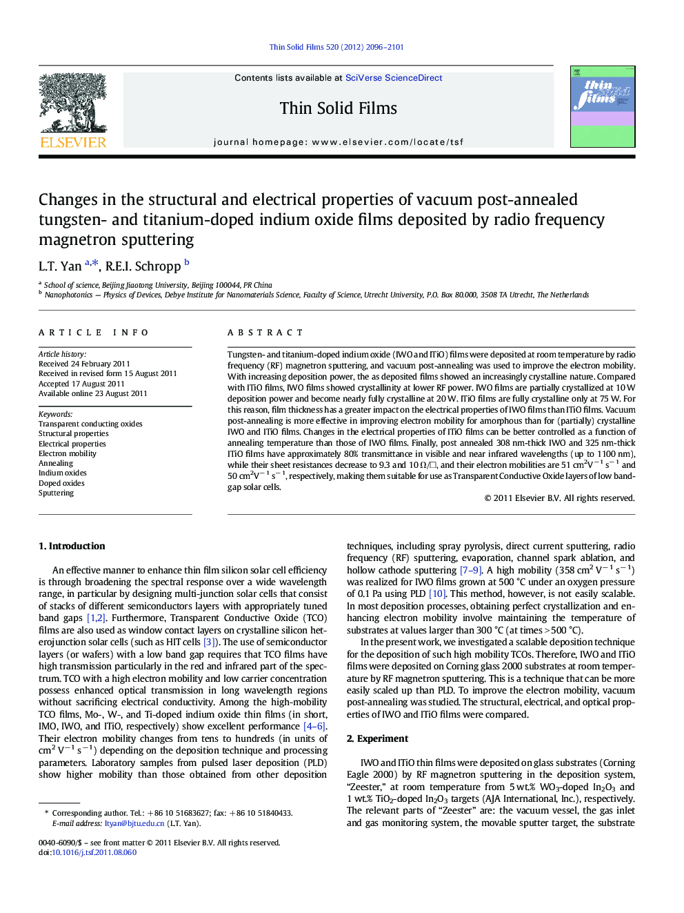 Changes in the structural and electrical properties of vacuum post-annealed tungsten- and titanium-doped indium oxide films deposited by radio frequency magnetron sputtering