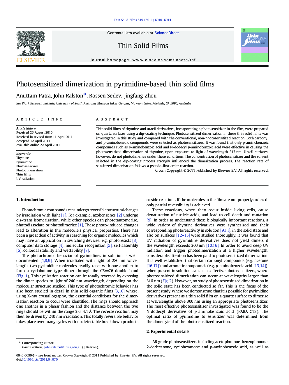 Photosensitized dimerization in pyrimidine-based thin solid films