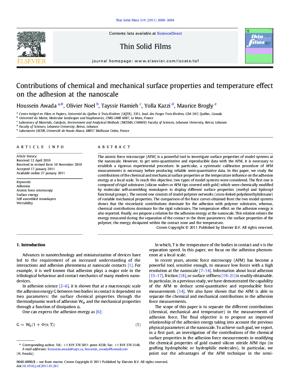 Contributions of chemical and mechanical surface properties and temperature effect on the adhesion at the nanoscale