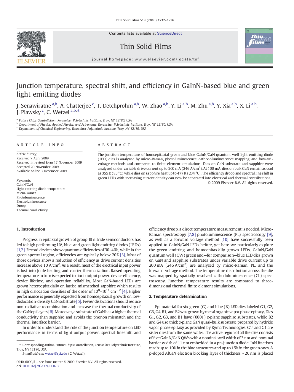 Junction temperature, spectral shift, and efficiency in GaInN-based blue and green light emitting diodes