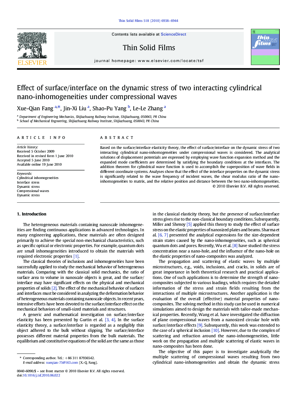 Effect of surface/interface on the dynamic stress of two interacting cylindrical nano-inhomogeneities under compressional waves