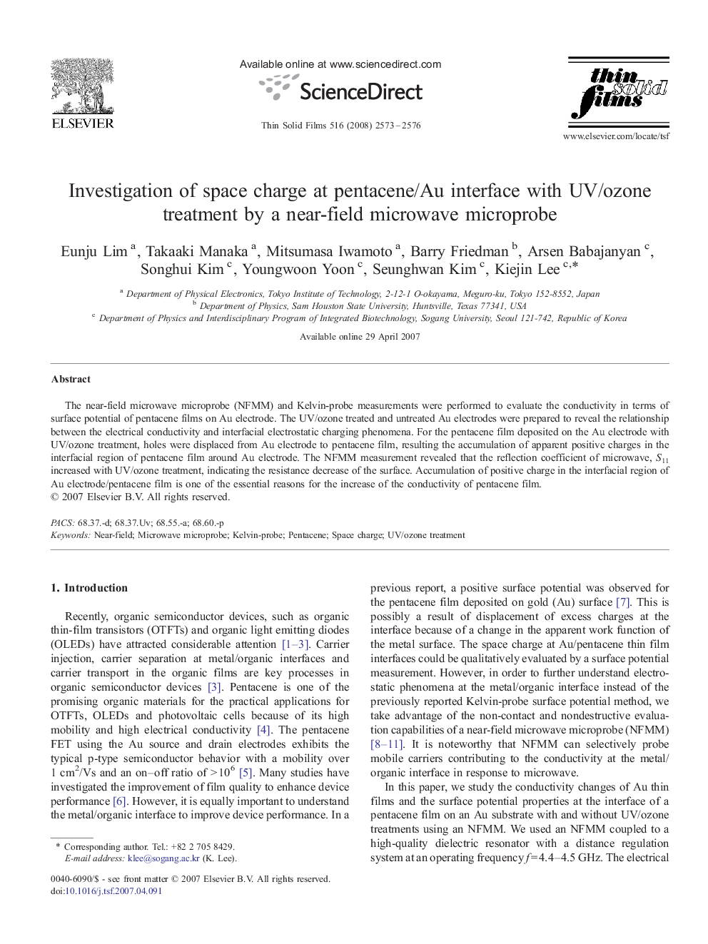 Investigation of space charge at pentacene/Au interface with UV/ozone treatment by a near-field microwave microprobe