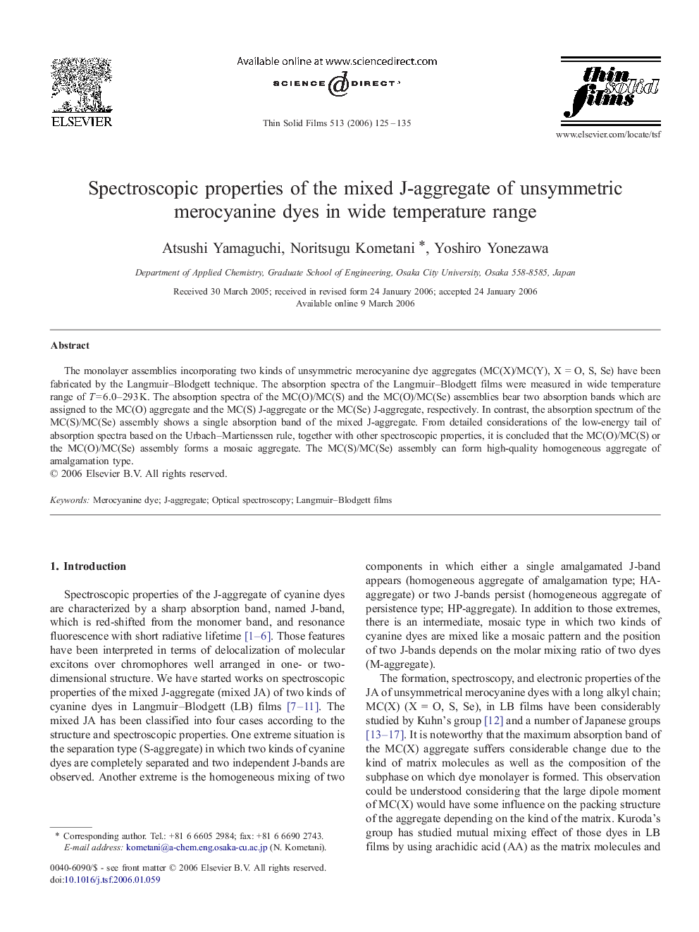 Spectroscopic properties of the mixed J-aggregate of unsymmetric merocyanine dyes in wide temperature range