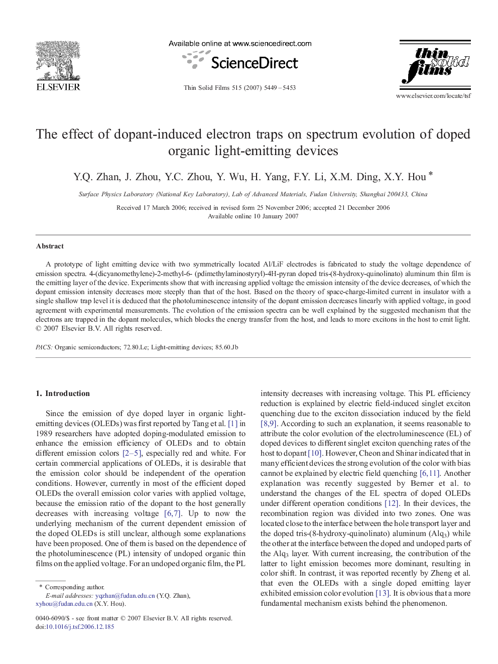 The effect of dopant-induced electron traps on spectrum evolution of doped organic light-emitting devices