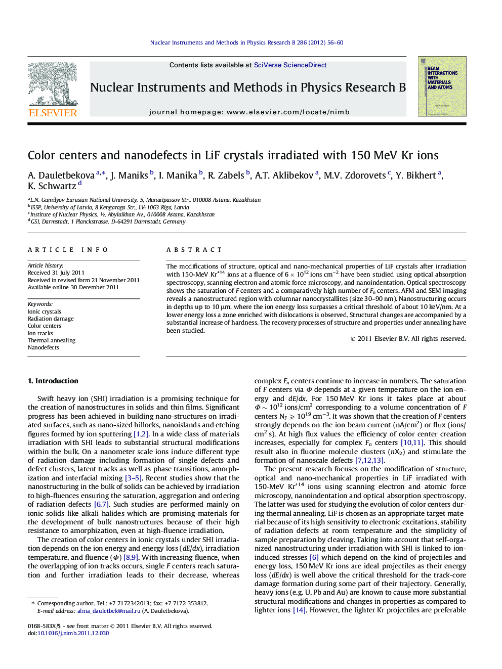 Color centers and nanodefects in LiF crystals irradiated with 150 MeV Kr ions