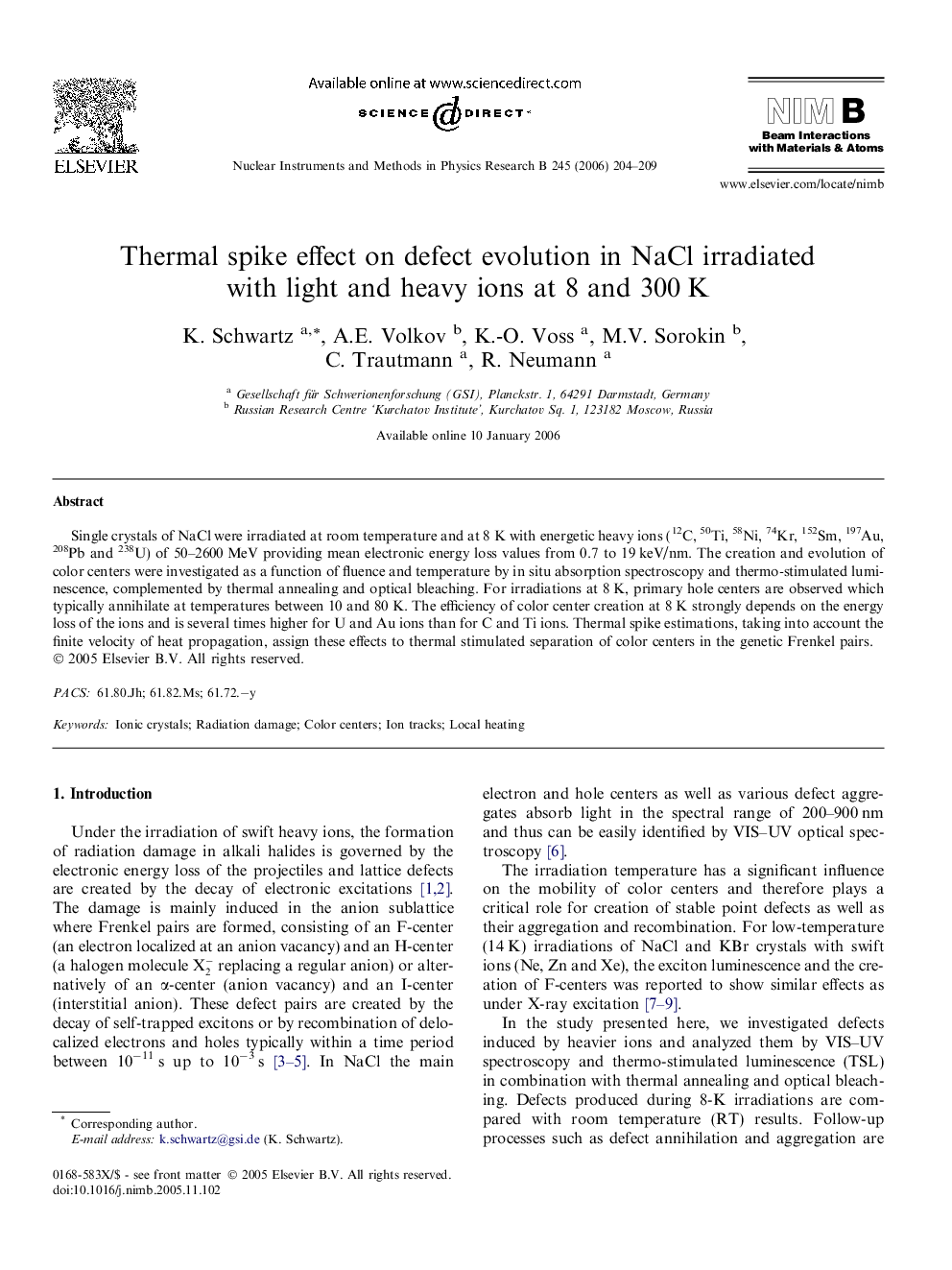 Thermal spike effect on defect evolution in NaCl irradiated with light and heavy ions at 8 and 300 K